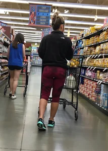 Milf grocery shopping in red leggings with a great ass