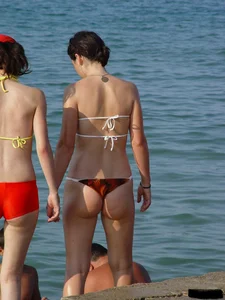 Beach voyeur girls in bikinis, thongs and topless