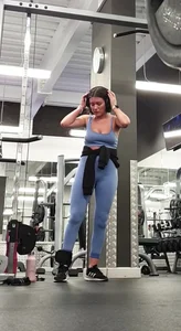 Bending gym babe stern face