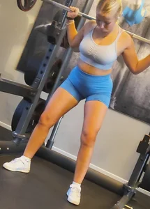 Small blonde pawg in light blue pants squatting as low as she can. Frontal view. OC