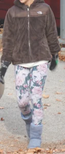 Skinny teen neighbor raking leaves in tight floral patterned leggings