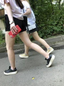 Couple of candid teens walking down the street