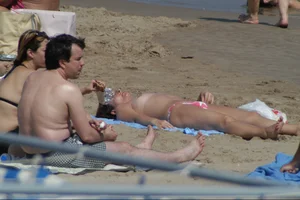 Girls on a nude beach in Sitges, Spain