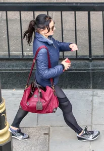 Brunette lady in leggings out walking