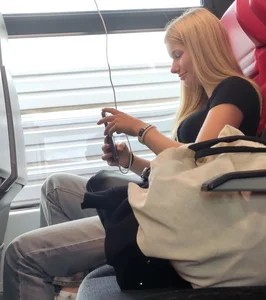 Hot busty blonde on train