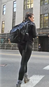 Black spandex and little grey boots crossing the street - such a cutie