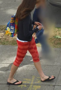 Beautiful brunette teen in orange patterned leggings