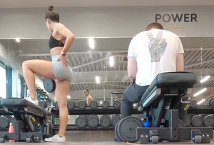 Gym brunette in tight grey shorts bending over, part 3