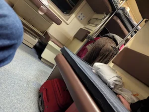 Sleeper train candid girl wearing brown pants bending over