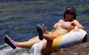 Sexy party girls in bikinis on a lake