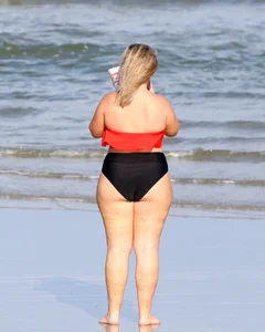 Thick BBW blonde lady in a bikini at the beach