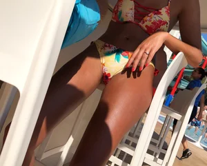 Skinny and sexy tanned bikini girl out at the pool