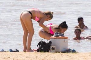 Candid beach girls in thongs