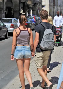 Beautiful teen out with boyfriend in short jean shorts