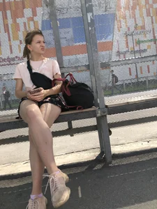 Bus Stop Girl Sitting with Crossed Legs Street Candid Photos