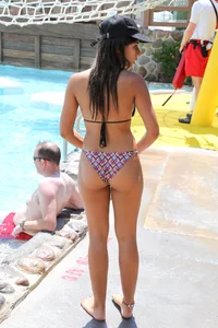 Hot little brunette babe in her bikini at the waterpark