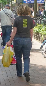 Big ass in tight blue jeans, a milf is walking down the street creepshot