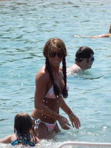Lady with nice tits in a white bikini on the beach