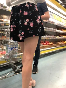 Girl With Amazing Legs on Hight Heeled Sandals at the Supermarket Closeup Photos