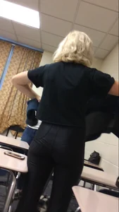 Blonde Girl in Tight Black Pants Standing in Class - College Photo
