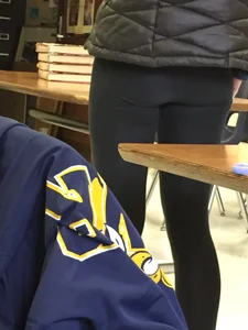 Flat booty and slim legs in leggings closeup