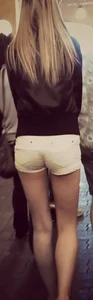 Skinny blonde girl in little yellow shorts with a tight ass