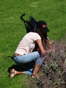 Skinny milf in tight jeans showing a bit of ass crack