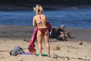 Hilary Duff in maroon bikini on the beach with a big booty