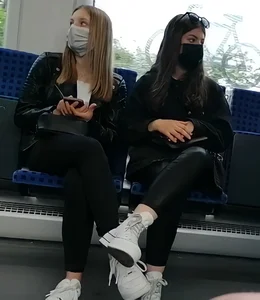 A couple of hot chicks in masks and tight pants sitting in a public bus creepshots