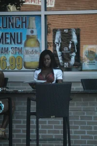 Sexy ebony Tilted Kilt employee in her uniform