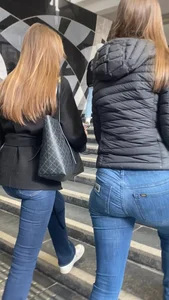 Nice big ass in tight blue jeans walking up stairs and standing in front of me