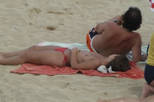 Topless girls on a beach in Barcelona