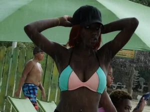 Candid black family, milf and teens on the beach in bikinis