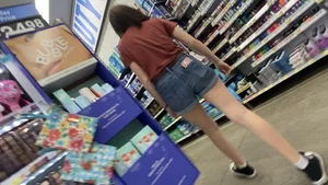 Cute Teen Candid Girl in Jean Shorts Bending Over And Squatting at the Store, Adjusting Shorts Between Her Butt Cheeks At One Point