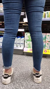 Brunette girl with nice ass sexy PAWG in tight jeans in a store