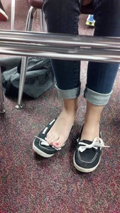 College Girl’s Feet Under Desk in Classroom with One Shoe Taken Off Candid Photo