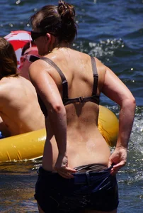 Sexy party girls in bikinis on a lake