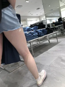 Hot Girl with Pale Skin in a Store Wearing Blue Denim Shorts Creepshots
