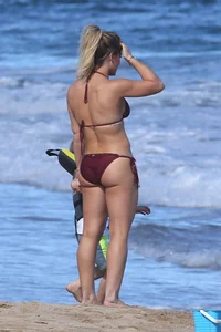 Hilary Duff in maroon bikini on the beach with a big booty