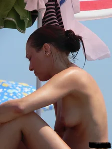 Sexy girls going topless at the beach showing off their sexy bodies