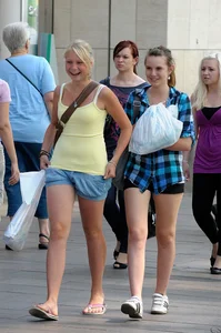Pretty blonde and brunette friend walking in shorts