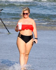 Thick BBW blonde lady in a bikini at the beach
