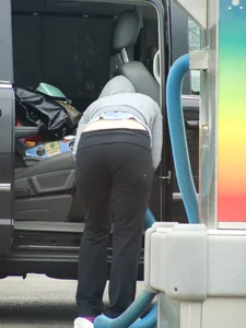Girls cleaning their cars in jeans and pants