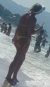 Big booty white chick in a yellow thong at the beach