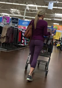 Sexy blonde shopping at Walmart in purple leggings with some vpl