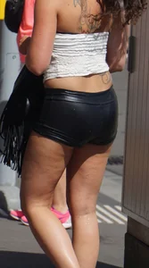 Girl out in tiny little leather shorts with a decent ass