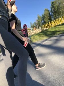 Skinny Girl in Grey Leggings Walking Past the Camera Candid Photos Gallery