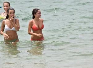 Two sexy ass girls on the beach in bikinis