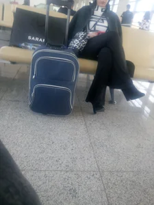 Sitting With Crossed Legs at a Station