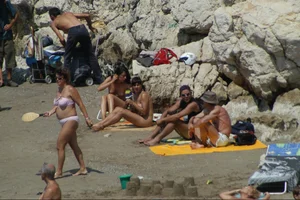 Girls on a nude beach in Sitges, Spain